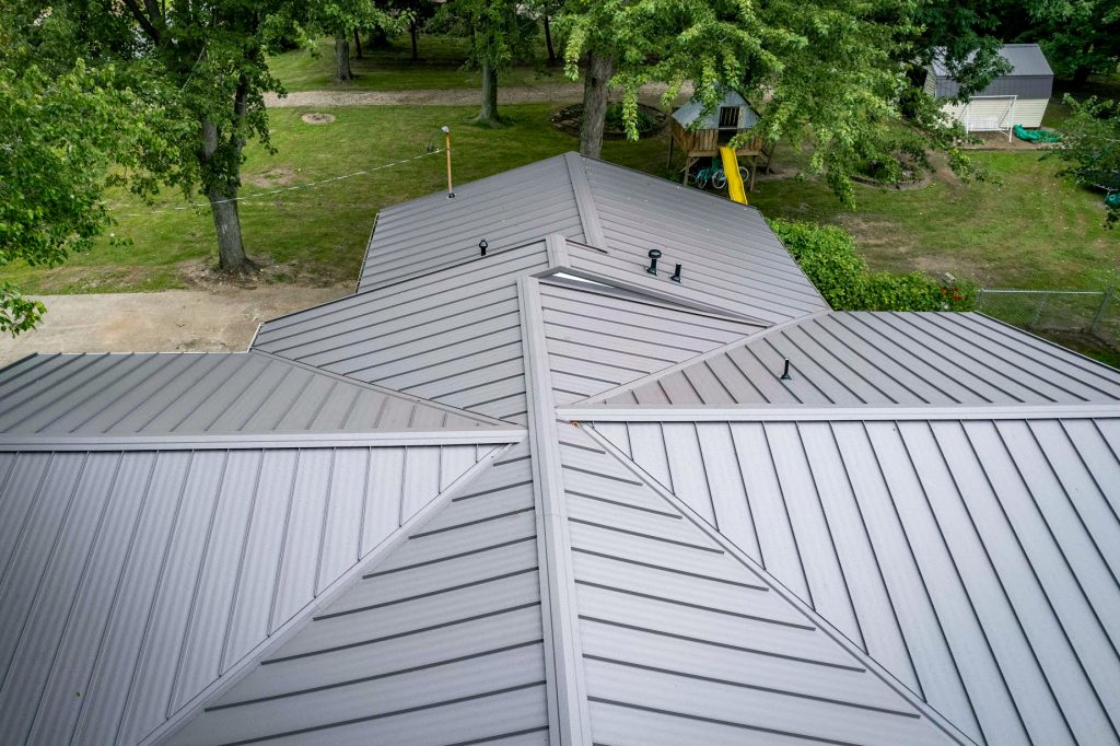 A triangular standing seam metal roof, showcasing sleek lines and a modern design.